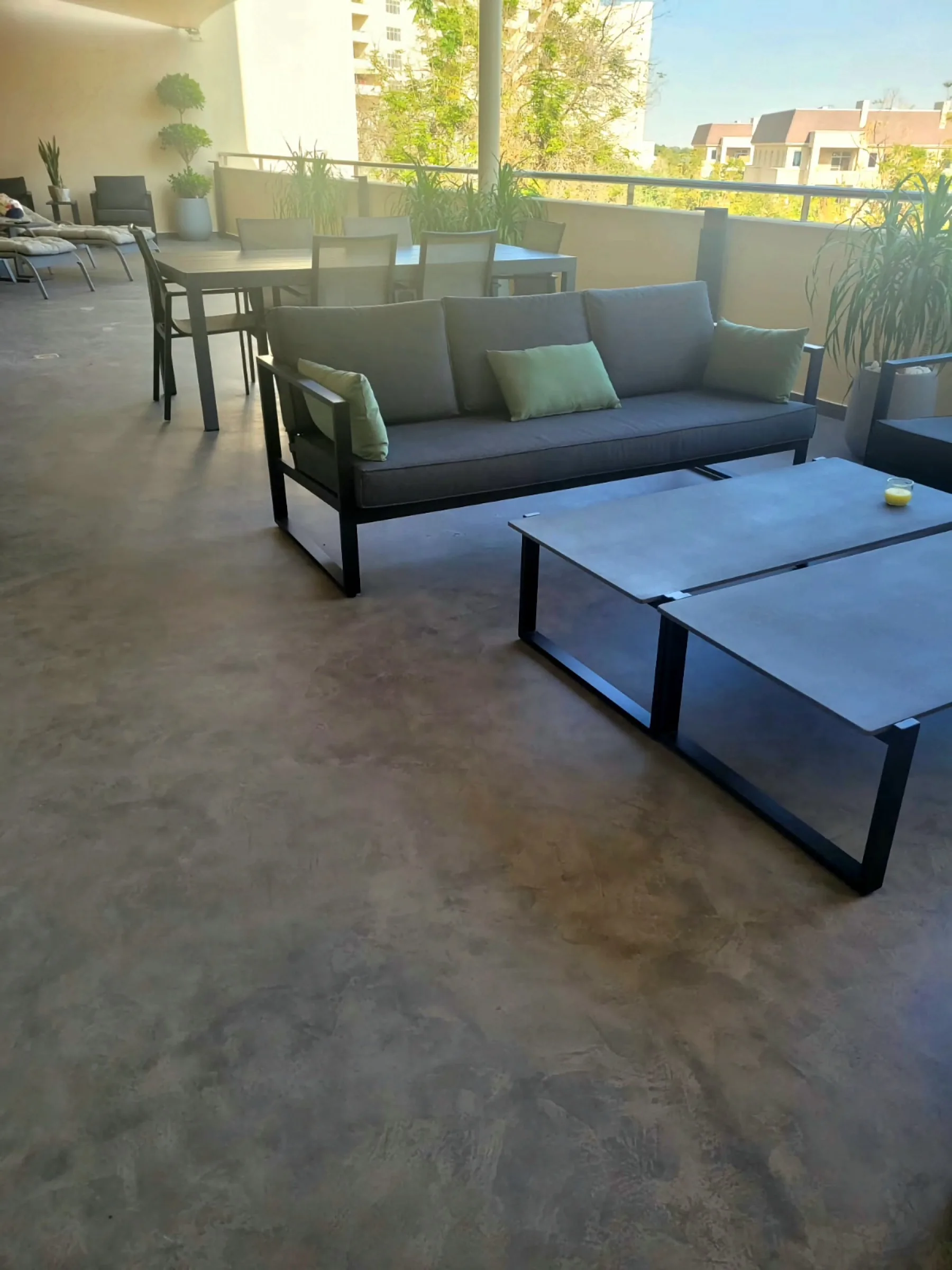 Private outdoor terrace with seamless microtopping floor