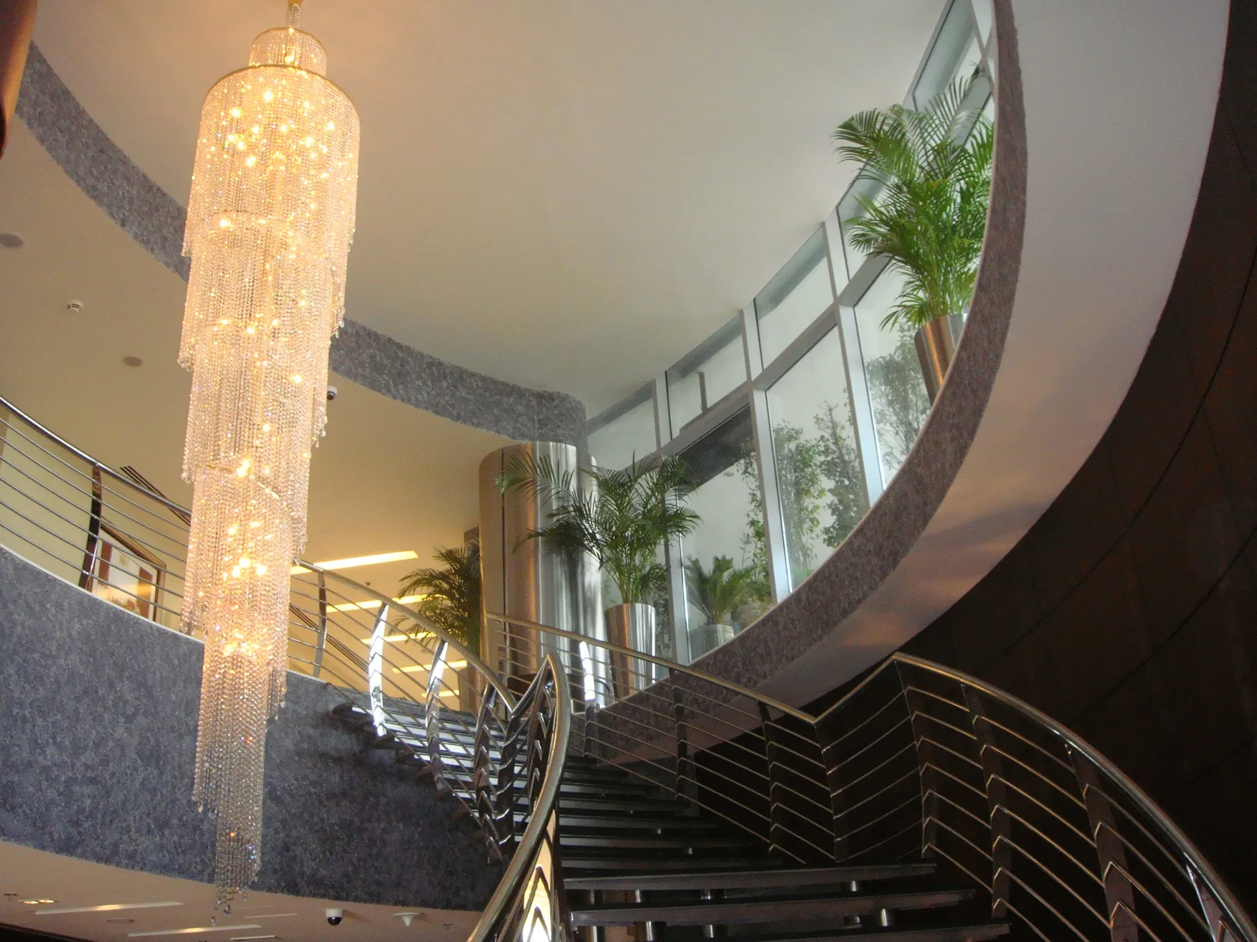 Sculptural staircase and chandelier in the Ramada hotel lobby